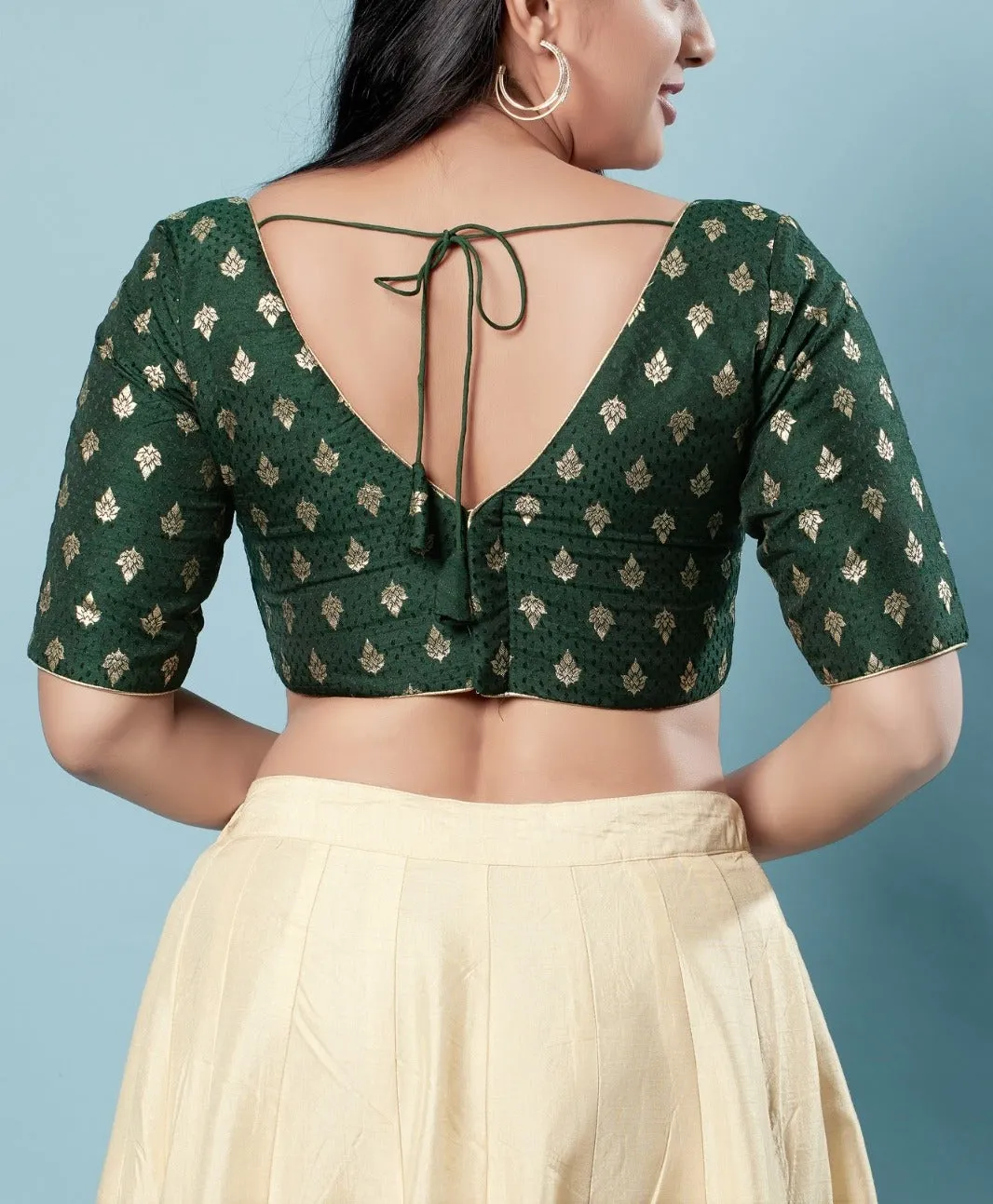 Appealing Green Colored V Neck And Back Open Blouse With Butta Motifs For Women